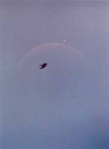 Faint lunar crescent during the double occultation
