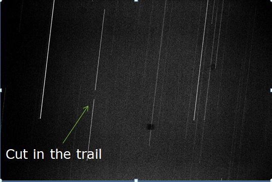 Star-trail photograph with the occultation break marked by an arrow